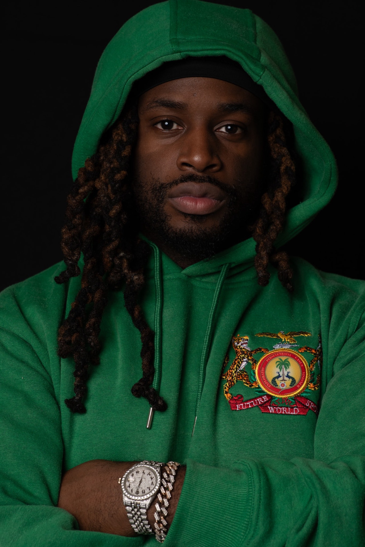 Kino Beats wearing a green hoodie